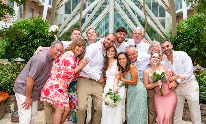 sailaway-wedding-cruise-family-celebration Bride and groom posing with family and friends during a Sailaway Wedding Cruise celebration.